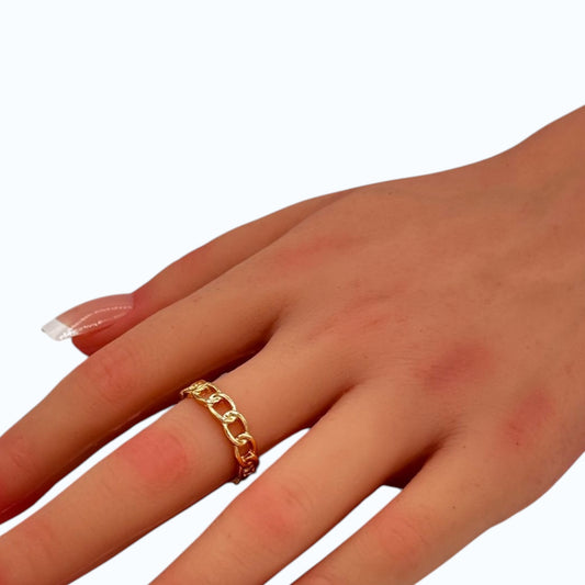 Chain Ring gold tone chain link band worn on woman finger