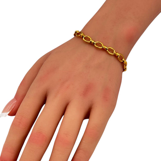 Classic Link Bracelet gold oval link chain worn on woman wrist