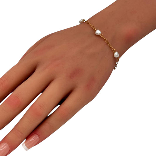 Delicate Love Bracelet gold chain with pearl accents on woman wrist