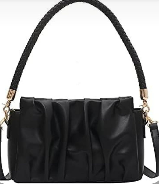 A black vegan leather handbag with a structured design and a braided handle.