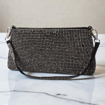 Sleek black glitter shoulder purse with subtle shimmer and a classic party-ready silhouette.