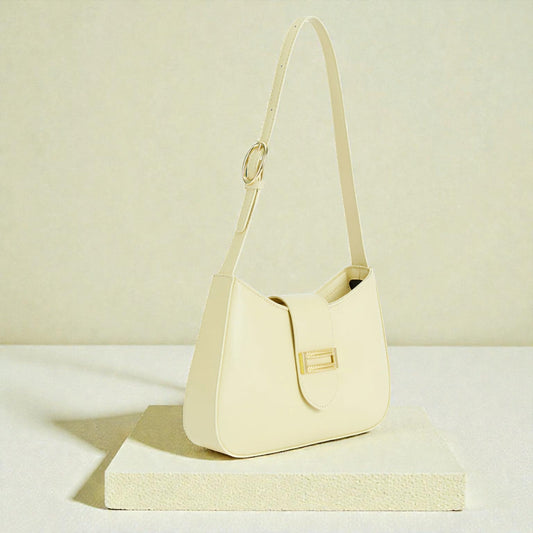 Beige handbag on a light beige background
