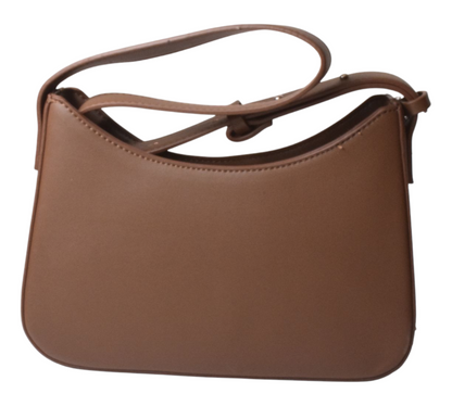 Brown handbag with a strap on a white background