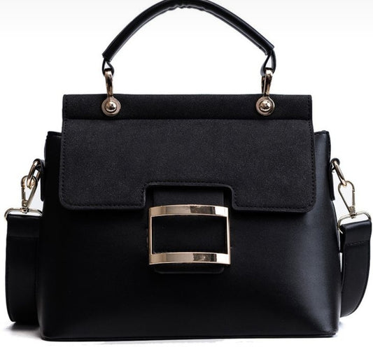 Black matte leather vintage crossbody bag with a gold buckle and a detachable strap.