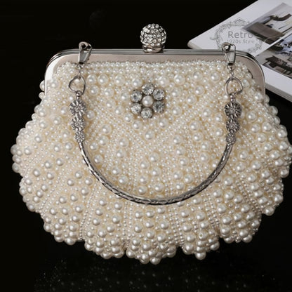 Elegant white evening purse fully covered in shimmering pearls with a top clasp and detachable chain strap.