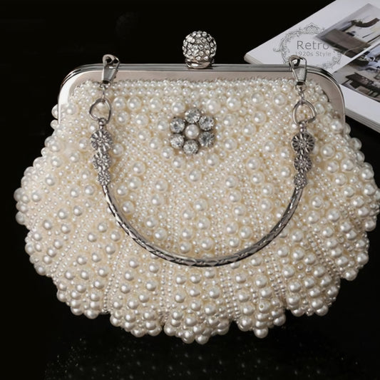 Elegant white evening purse fully covered in shimmering pearls with a top clasp and detachable chain strap.