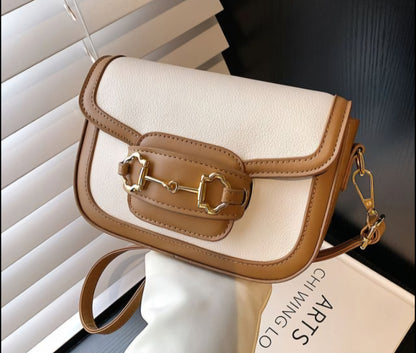 Dorole Horse Bitbuckle Bag flap shoulder handbag on plain background
