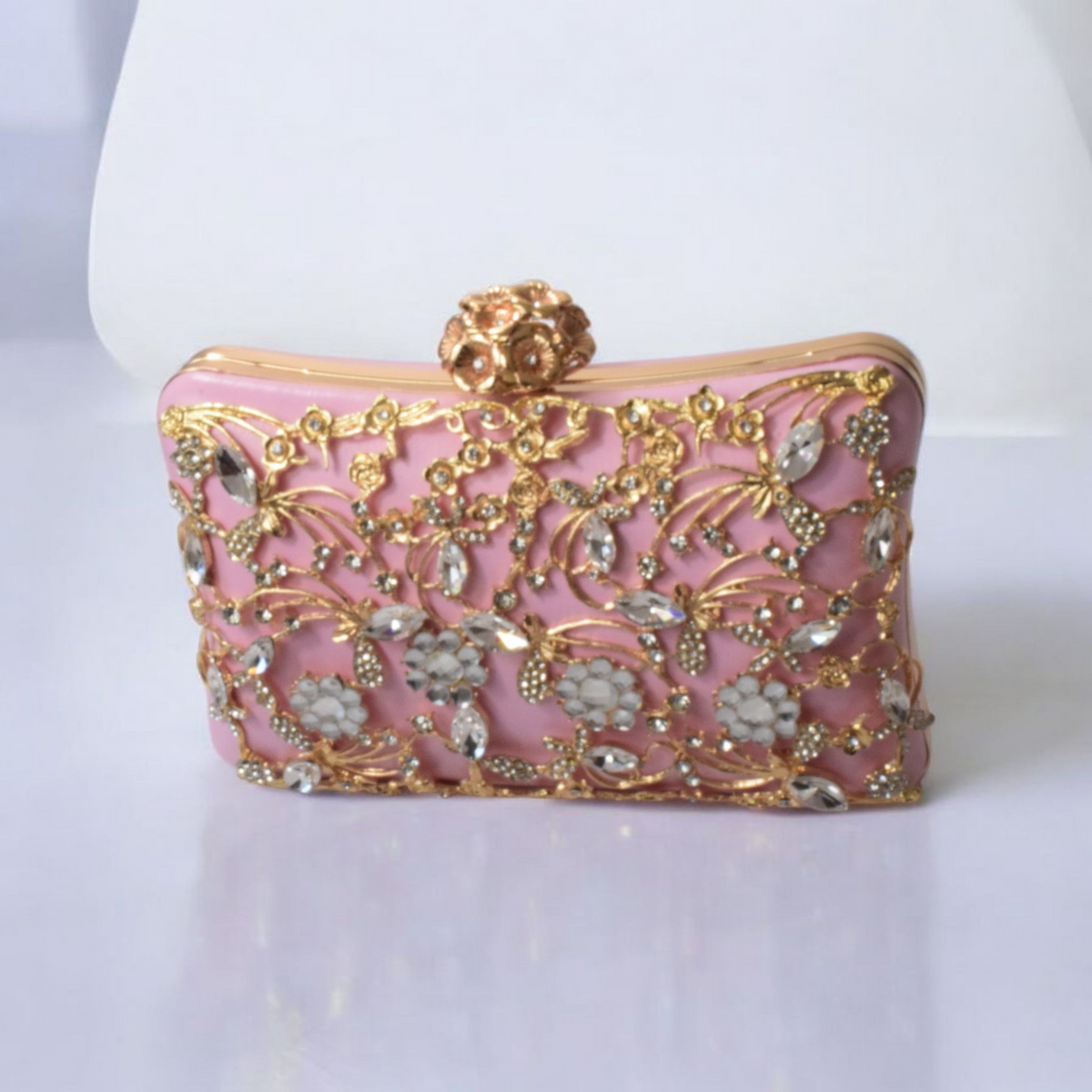 Dorole Sparkle Clutch with Rhinestones adorned in floral designs and gold embellishments for evening elegance.