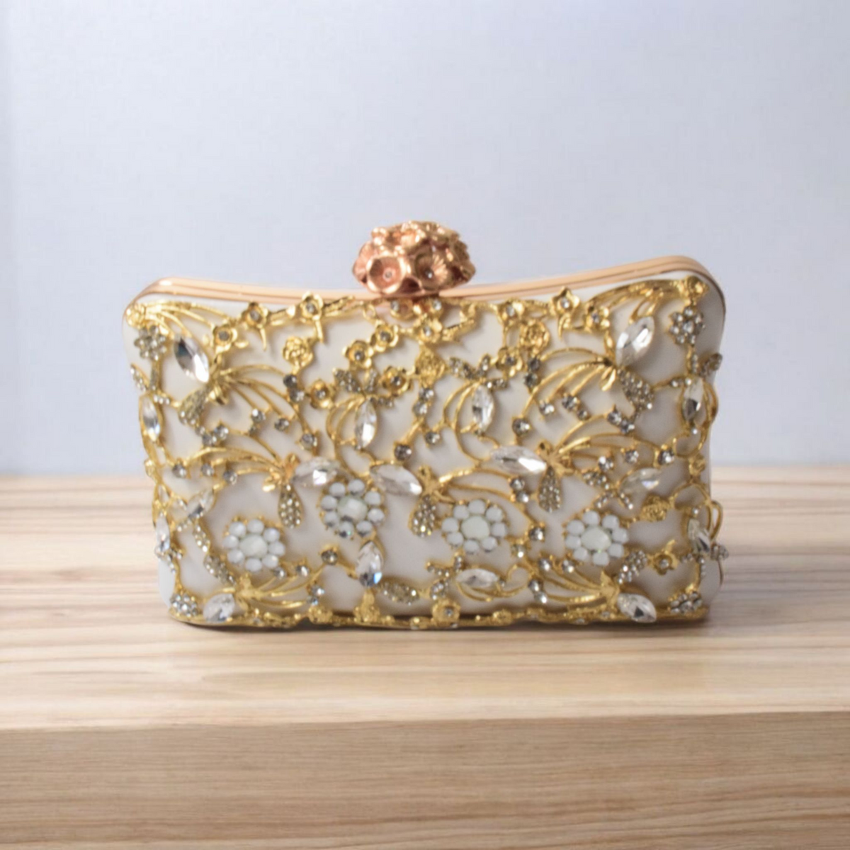 Dorole Sparkle Clutch with Rhinestones featuring intricate gold and rhinestone detailing on a sleek design.