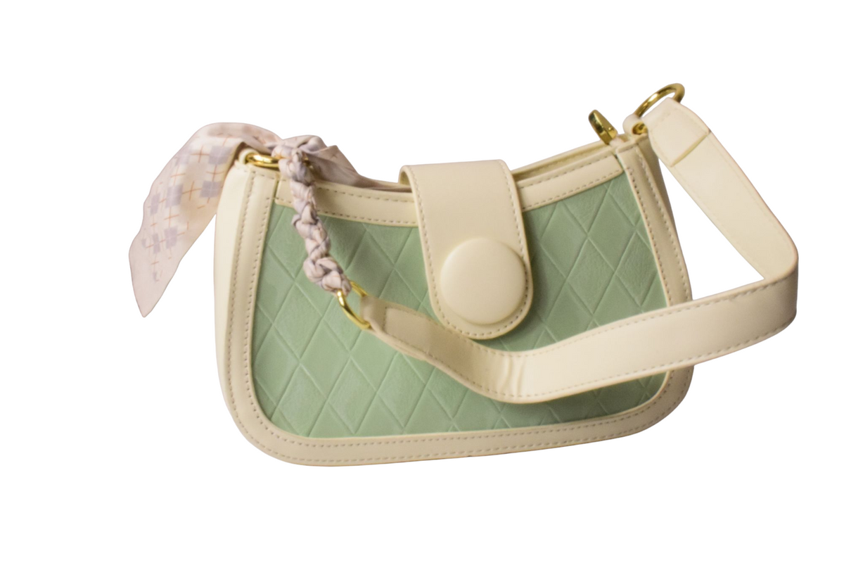 Green and beige handbag with a matching strap on a white background