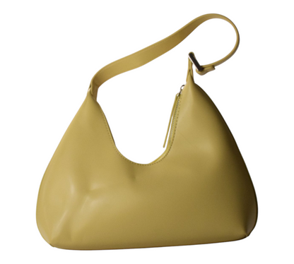 Mustard yellow curved shoulder bag with a sleek, structured silhouette.