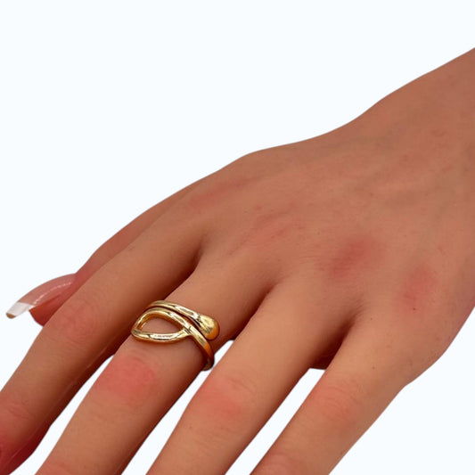 Fluid Loop Ring gold tone sculptural loop band worn on woman finger