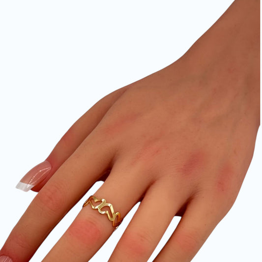 Love Wave Ring gold tone wave band worn on woman finger
