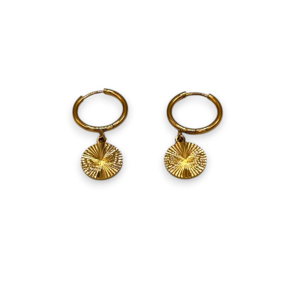 Pair of gold lumiere drop hoops earrings with sunburst charms on a white background