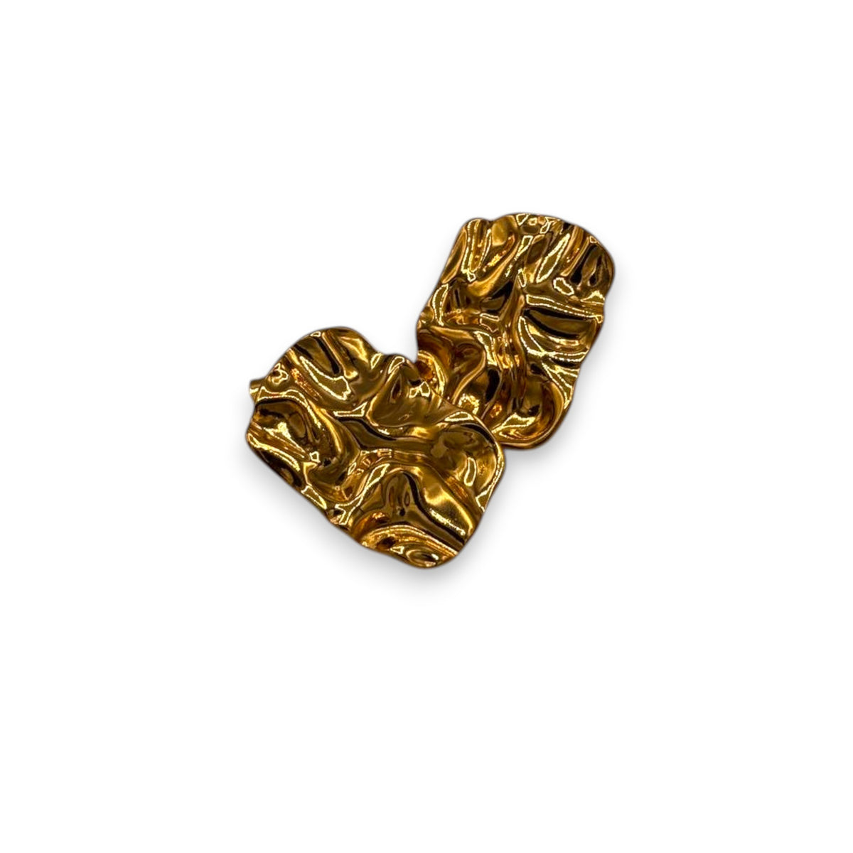 Gold heart-shaped object on a white background