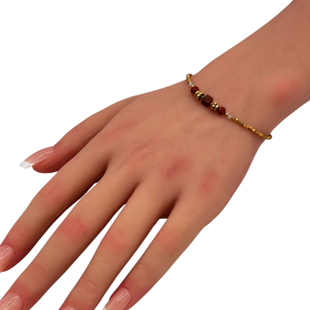 Natural Bead Chain bracelet with dark beads and gold accents worn on woman wrist