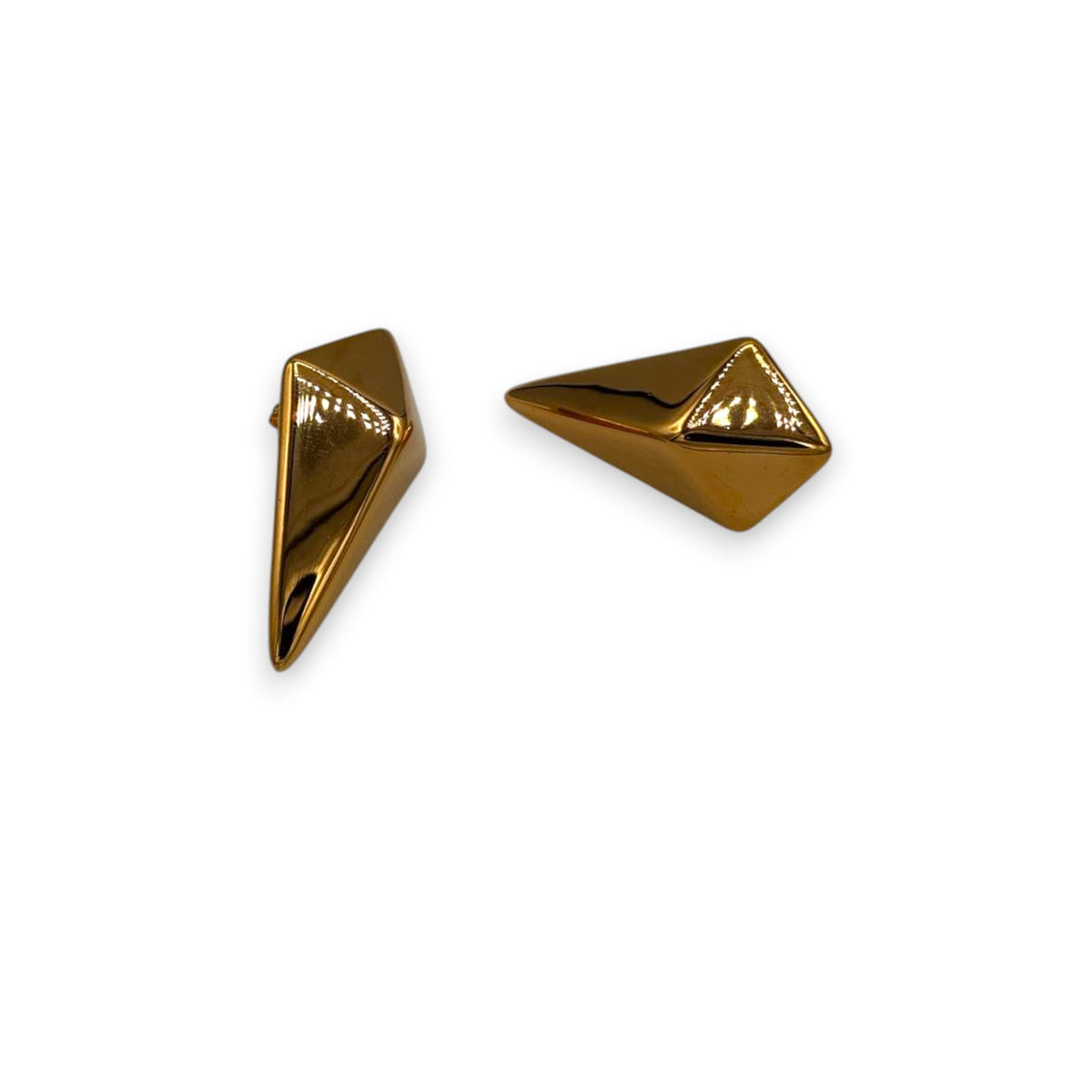 Gold pyramid-shaped ocean muse studs earrings on a white background