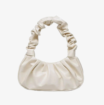 Beige Pleated Everyday Bag vegan leather handbag on plain background