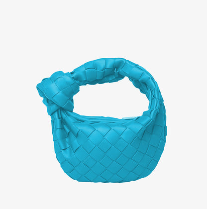 Horn Knotted Underarm Handbag women's woven shoulder bag on plain background