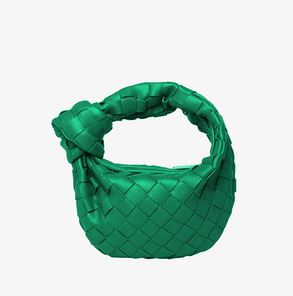 Horn Knotted Underarm Handbag women's woven shoulder bag on plain background