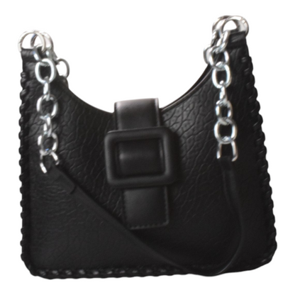 A silver vegan leather shoShockcrush Chic Square Shoulder Bag vegan leather women's handbag on marble surfaceulder bag with a brown strap and buckle, placed on a marble surface.