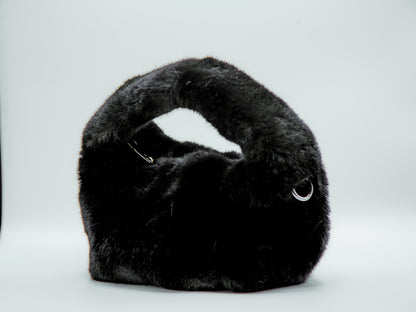 Black fur handbag on a white background