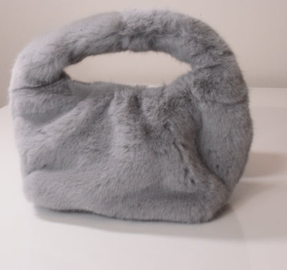 Gray fur handbag on a white background